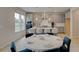 Stylish kitchen featuring an island with seating, gray cabinets, and modern pendant lighting at 540 Teversham Dr, Mcdonough, GA 30253