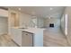 Spacious open living room, adjacent to kitchen, includes modern flooring and a cozy fireplace focal point at 540 Teversham Dr, Mcdonough, GA 30253