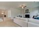 Bright, open living room featuring a cozy fireplace and modern furnishings at 540 Teversham Dr, Mcdonough, GA 30253