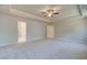 Spacious primary bedroom includes neutral tones, ceiling fan, and a peaceful retreat for relaxation at 540 Teversham Dr, Mcdonough, GA 30253