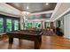 Basement featuring a pool table, hardwood floors, recessed lighting, and several windows with natural light at 960 Tiverton Ln, Alpharetta, GA 30022