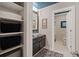 Contemporary bathroom with a vessel sink, storage shelves, and a separate toilet room at 960 Tiverton Ln, Alpharetta, GA 30022