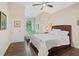 Cozy bedroom featuring hardwood floors, bright window nook and ample natural light at 960 Tiverton Ln, Alpharetta, GA 30022