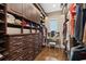 A walk-in closet with custom organization, a vanity table, and built in lighting at 960 Tiverton Ln, Alpharetta, GA 30022
