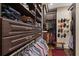 A custom walk-in closet with drawers and clothing racks at 960 Tiverton Ln, Alpharetta, GA 30022