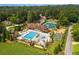Aerial view of community pool, tennis courts, playground, and manicured landscaping at 960 Tiverton Ln, Alpharetta, GA 30022
