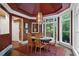 Charming dining room with large windows, elegant lighting, and a cozy ambiance for Gathering gatherings at 960 Tiverton Ln, Alpharetta, GA 30022