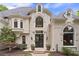 Stately home featuring decorative windows and a welcoming double-door front entrance at 960 Tiverton Ln, Alpharetta, GA 30022