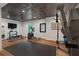 Well-equipped home gym with modern exercise machines and a mirrored wall for workout routines at 960 Tiverton Ln, Alpharetta, GA 30022