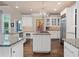 Spacious kitchen with stainless steel appliances, granite countertops, and ample storage, perfect for cooking and entertaining at 960 Tiverton Ln, Alpharetta, GA 30022