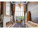 Beautiful living room with large windows, fireplace, and elegant decor perfect for entertaining and relaxation at 960 Tiverton Ln, Alpharetta, GA 30022