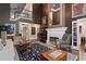 Elegant living room with fireplace, high ceilings, and open layout, showcasing the home's sophisticated design at 960 Tiverton Ln, Alpharetta, GA 30022