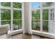 Cozy sitting area with bright windows providing a view of the surrounding greenery at 960 Tiverton Ln, Alpharetta, GA 30022