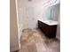 Well-lit bathroom boasts a double sink vanity with dark wood cabinetry and a large mirror at 2089 Belmont Cir, Conyers, GA 30012