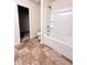 Bathroom featuring a tub-shower combo with white tile surround at 2089 Belmont Cir, Conyers, GA 30012