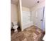 Bright bathroom features a bathtub and shower combination with a tiled floor at 2089 Belmont Cir, Conyers, GA 30012