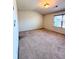 Bright bedroom has neutral walls, plush carpet, and a window with blinds for natural light at 2089 Belmont Cir, Conyers, GA 30012