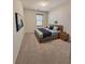Bedroom with neutral colored walls, carpet, and natural light from a window at 2089 Belmont Cir, Conyers, GA 30012
