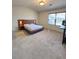 Contemporary bedroom features a unique platform bed with built-in bedside tables and modern lighting at 2089 Belmont Cir, Conyers, GA 30012