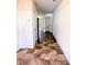 Hallway with tiled floors and a door leading to a closet or pantry at 2089 Belmont Cir, Conyers, GA 30012