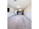 Expansive living area with carpet, bar seating and a view of the kitchen at 2089 Belmont Cir, Conyers, GA 30012