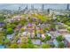 Aerial shot of Atlanta neighborhood with lush trees and skyline in distance at 210 Sampson Ne St # 8, Atlanta, GA 30312