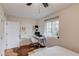 Bedroom featuring a ceiling fan, hardwood floors, neutral paint and a bright window over a study desk at 210 Sampson Ne St # 8, Atlanta, GA 30312