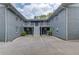 Building exterior showcasing a central staircase leading to multiple units above a parking lot at 210 Sampson Ne St # 8, Atlanta, GA 30312