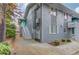 Charming entryway with turquoise door, white railing, and lush greenery at 210 Sampson Ne St # 8, Atlanta, GA 30312
