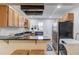 Charming kitchen featuring wood cabinets, granite counters, stainless steel appliances, and tile flooring at 210 Sampson Ne St # 8, Atlanta, GA 30312