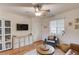 Cozy living room featuring hardwood floors, a ceiling fan, and a comfortable sitting area with natural light at 210 Sampson Ne St # 8, Atlanta, GA 30312