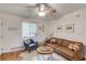 Comfortable living room with a plush sofa, stylish chair, and warm hardwood floors at 210 Sampson Ne St # 8, Atlanta, GA 30312
