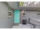 Charming patio with seating, a bright door, and gray brick exterior at 210 Sampson Ne St # 8, Atlanta, GA 30312