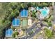 Community aerial view with tennis courts, pool, sand volleyball, clubhouse, parking, and mature trees at 3918 Windgrove Xing, Suwanee, GA 30024