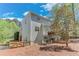 Side view of a two-story home with a backyard patio and a wooden fence at 3918 Windgrove Xing, Suwanee, GA 30024