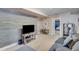 Cozy basement with rustic wood accent wall and comfortable seating at 3918 Windgrove Xing, Suwanee, GA 30024