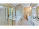 Bright bathroom featuring double sinks and vanity and a separate shower and tub at 3918 Windgrove Xing, Suwanee, GA 30024