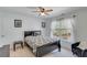 Bright bedroom with ceiling fan and a window that provides plenty of natural light at 3918 Windgrove Xing, Suwanee, GA 30024