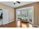 Bright bedroom with a bay window, hardwood floors, and a cozy bench at 3918 Windgrove Xing, Suwanee, GA 30024