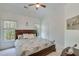 Inviting bedroom with ceiling fan and natural light at 3918 Windgrove Xing, Suwanee, GA 30024