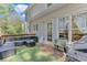Cozy outdoor deck with comfortable seating and a built-in grill at 3918 Windgrove Xing, Suwanee, GA 30024