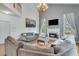 Vaulted living room with fireplace and large windows providing lots of natural light at 3918 Windgrove Xing, Suwanee, GA 30024