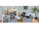 Comfortable living room with plush chairs, hardwood floors, and a view into the dining area at 3918 Windgrove Xing, Suwanee, GA 30024