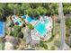 Overhead shot of a community pool area featuring multiple pools, water features, and ample seating at 3918 Windgrove Xing, Suwanee, GA 30024