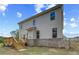 Two-story home with wood deck, neutral siding and brick foundation on a lush lawn at 576 Teversham Dr, Mcdonough, GA 30253