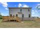The home's backyard with a wood deck overlooking the lawn at 576 Teversham Dr, Mcdonough, GA 30253