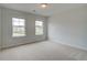 Bright bedroom with two windows allowing ample natural light to illuminate the space at 576 Teversham Dr, Mcdonough, GA 30253