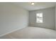 Empty bedroom with neutral carpet and a single window at 576 Teversham Dr, Mcdonough, GA 30253