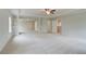 Expansive bonus room with neutral paint, plush carpet, and direct access to the staircase at 576 Teversham Dr, Mcdonough, GA 30253