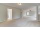 Open bonus room featuring neutral walls, plush carpet, and staircase access at 576 Teversham Dr, Mcdonough, GA 30253
